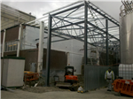 Temporary shrink wrap wall on scaffolding sealed to the building sides and floor during an extension to the production facility. Production continued during the building works. Gallery Thumbnail