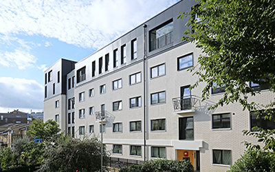 A combination of external wall insulation and resin brick slips create a thermally-efficient and visually striking appearance for a £7.8m residential refurbishment project in London Gallery Image